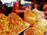 Stall holder at local food market.