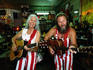 Musicians playing guitars inside Sandhills Curiosity Shop, Route 66.