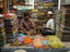 Shop workers sip tea at one of hundreds of clothing sellers, New Market.