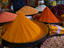 Mounds of spice powders are displayed by a vendor at New Market.
