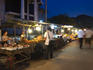 People shopping at a night market.