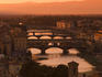 Bridges across River Arno at sunset.