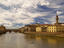 Rowers on River Arno with Ponte Veccio (left) and Palazzo Vecchio (right) in background.