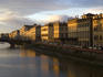 Sunlit buildings along Lungarno Corsini at dusk.