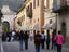 People strolling along Corso Sertorio towards Porta Romana.