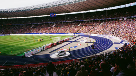 Soccer game and fans at Olympic Stadium.