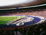 Soccer game and fans at Olympic Stadium.