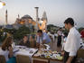 Dining at Balikci Sabahattin Fish Restaurant in Sultanhamet, with Aya Sofya in background.