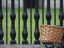 Bicycle pannier against railings.
