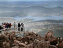 Tour group being photographed on top of Mount Wellington.