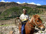 Boy on horse with lassoo.