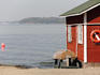 Rescue hut with boat, lifebelt on Pihlajasaari island.