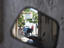 Street scene reflected in mirror of motor scooter, Patmos, Dodecanese Islands.