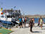 Passengers disembarking from a ferry, Delos, Cyclades Islands.