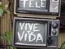 Television sculpture in someone's front garden, 'turn off the TV and live your life'.