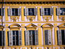 Shuttered windows on the decorative facade of the Piazza San Carlo