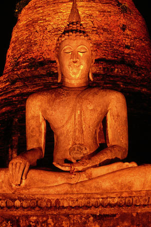 Seated Buddha at night.