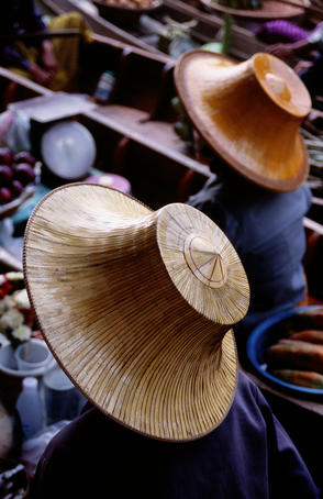 Overhead of women selling vegetables at floating market.