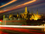 Car lights and Wat Phra Kaew (Temple of the Emerald Buddha) at night.