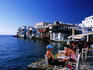 People sitting at waterside bar in Little Venice.