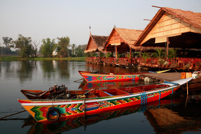 Long-tail boats and restaurants on River Kwai.