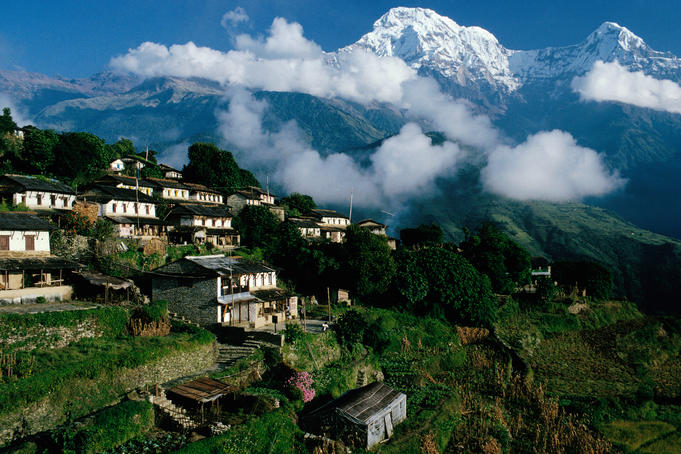 Village with Annapurna South and Hiunchuli in background.