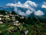Village with Annapurna South and Hiunchuli in background.