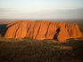 Aerial of Uluru (Ayers Rock) in late afternoon light.