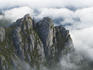 Crags rise above valley-filling cloud at dawn, Western Arthur Range.