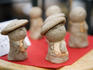 Japanese stone deities on display at a temple near Okochi-sanso Villa.