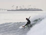 Surfer surfing at Rincon surf break during a big winter swell.