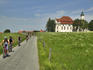 Children cycling past the Pilgramage Church of the Scourged Saviour.