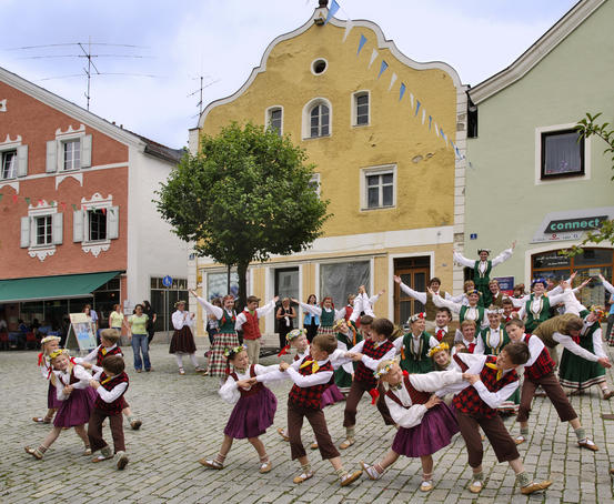Children performing traditional folk dances in the old quarter, Kelheim