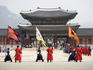 Ceremonial Guards and tourists outside the entrance to Gyeongbokgung Palace.