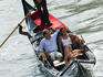 Overhead of tourists in gondola.