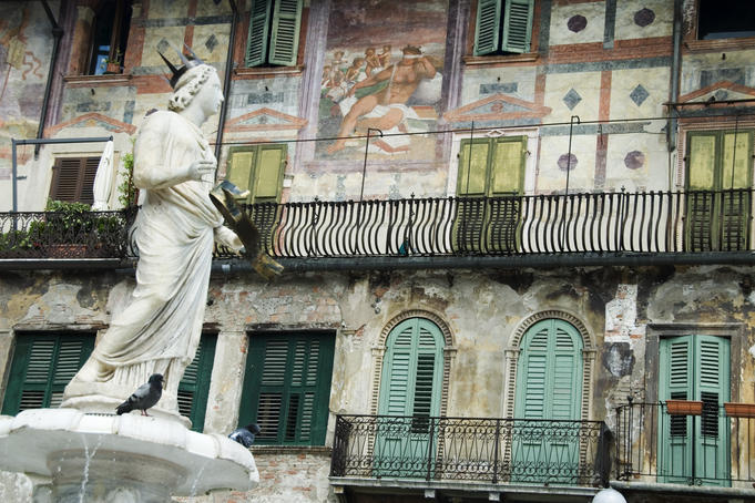 Statue of Madonna of Verona and facade of Casa Mazzanti.