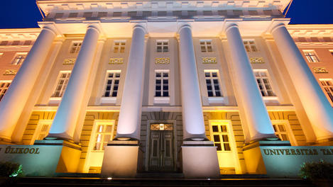 Facade of Tartu University at night.
