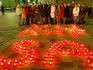 Crowd looking at candles commemorating All Soul's Day (Velines).