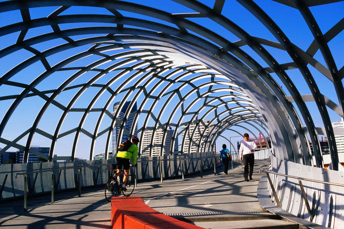 Cyclists and pedestrians on Webb bridge crossing Yarra River.
