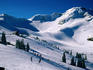 Skiers on the high ski slopes of Whistler Mountain, Coast Mountains.