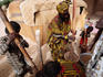Songhai women pounding grain.