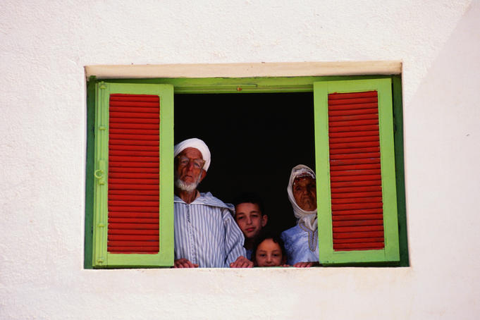Berber family looking out window, Nador