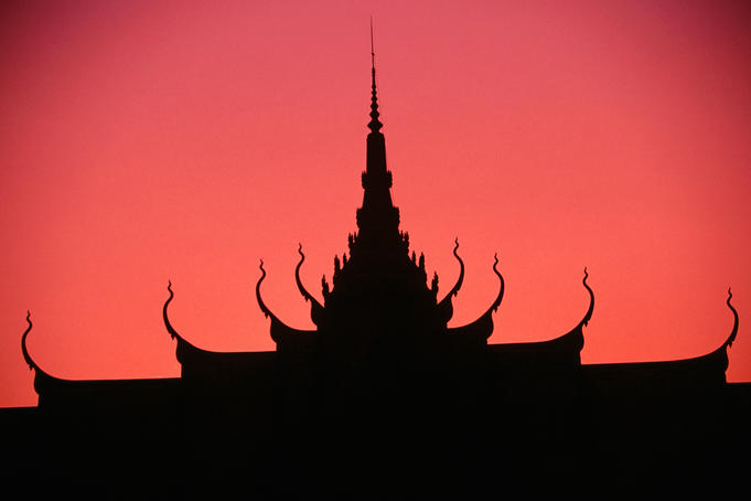Royal Palace silhouetted at sunset.