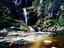 Hikers resting near waterfall, South Africa