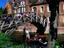 People punting under Queen's College near Mathematical Bridge