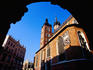 Exterior of Gothic Saint Mary's Church framed by an archway.