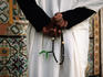 Muslim guard of Gurgi Mosque holding his rosary.