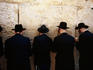 Men pray by the Western Wall (Wailing Wall).