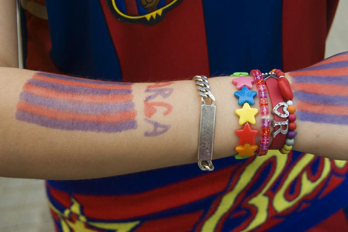 Young fan of the Futbol Club Barcelona, at Camp Nou Stadium.