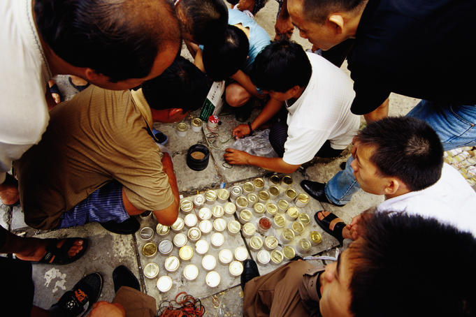Locals buying crickets at bird and insect market.